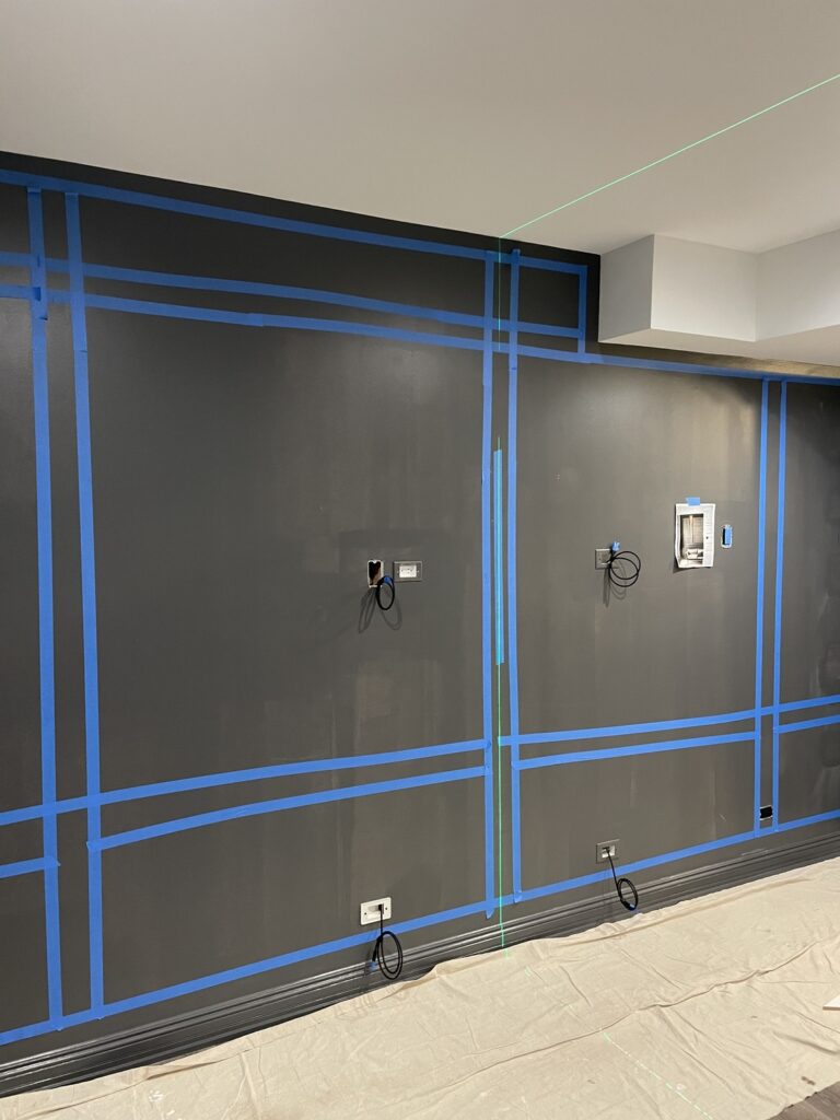 Black walls prepared with wiring and for fine detail work.